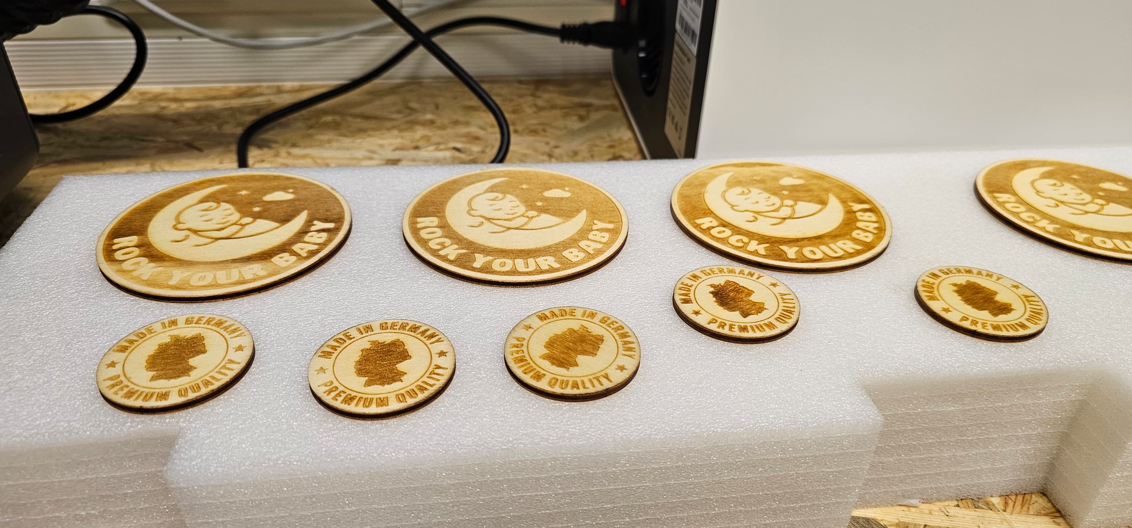 Laser-processed wood inlays and branding elements.